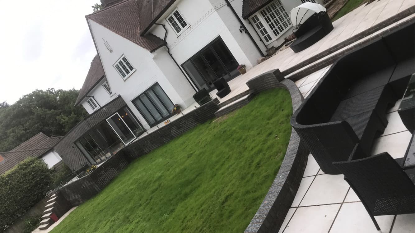 Large detached house rear extension with patio and landscaping — Wirral
