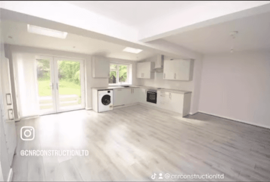 Structural knock-through Wirral — open plan living room after wall removal and RSJ installation