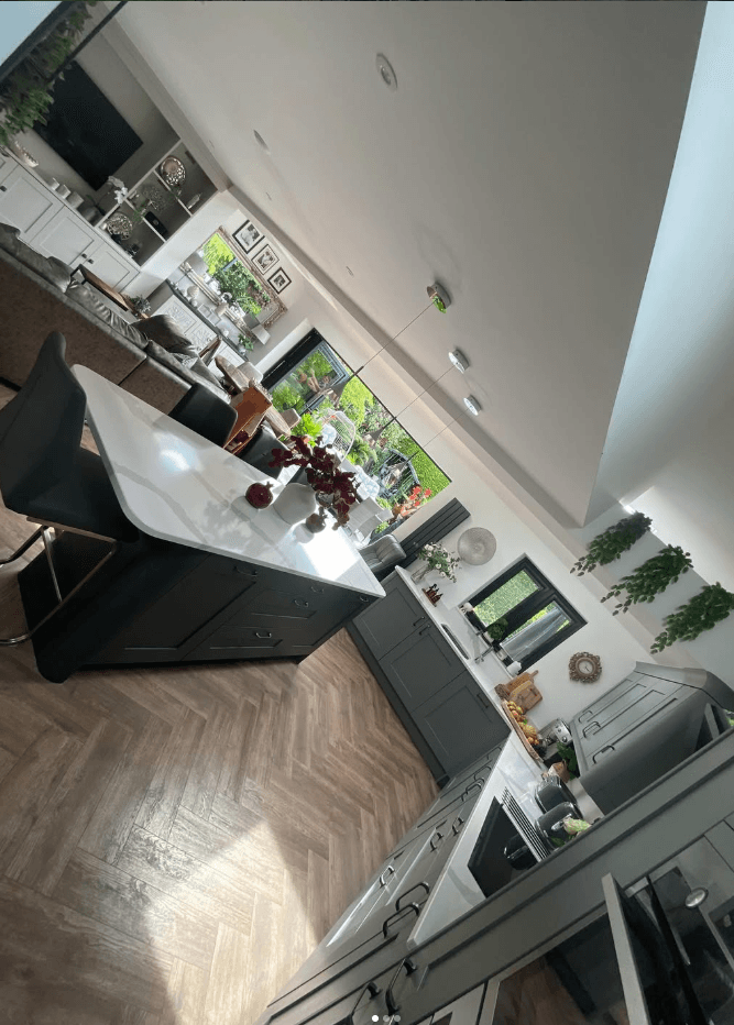 Kitchen extension Wirral — open plan kitchen and living space with herringbone flooring