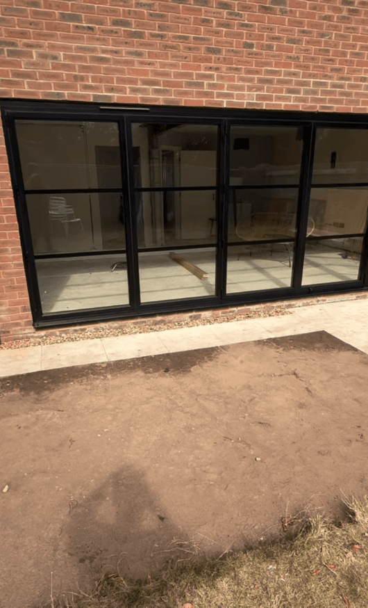 Knock-through extension Chester — glazed doors opening to garden