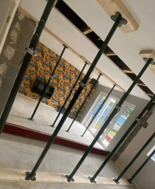 RSJ steel beam installation during structural knock-through — Chester